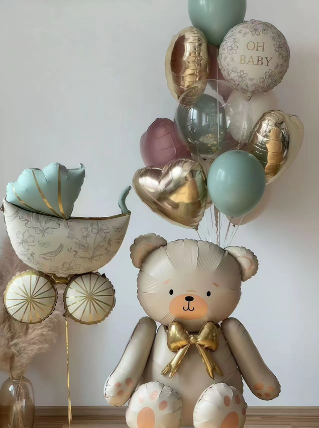 Teddy bear balloon with decorative balloons on a neutral background